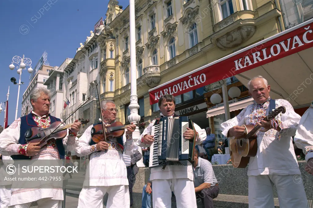 Low angle view of street musicians, Bana Josipa Jelacica Square, Zagreb, Croatia