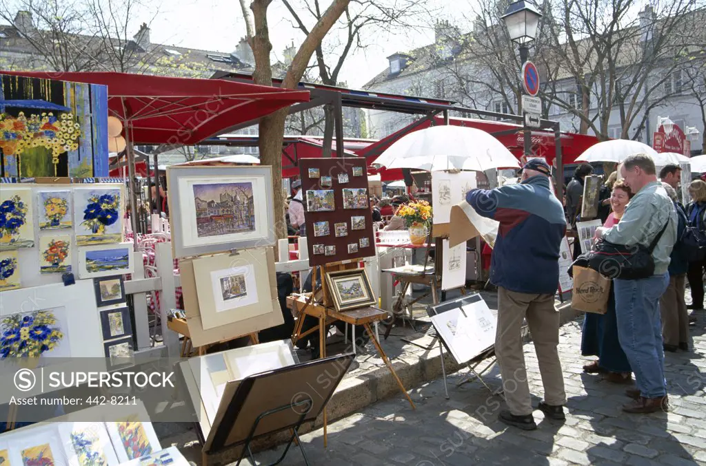 Painter with his paintings, Place du Tertre, Montmartre, Paris, France
