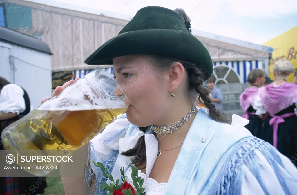 Drinking Beer, Girl Dressed in Bavarian Costume, Rosenheim, Bavaria, Germany