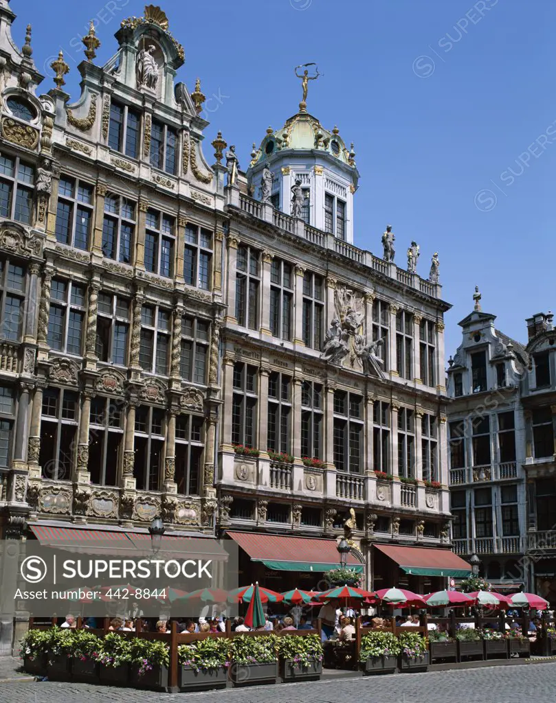 Tourists sitting at an outdoor cafe, Grand Place, Brussels, Belgium