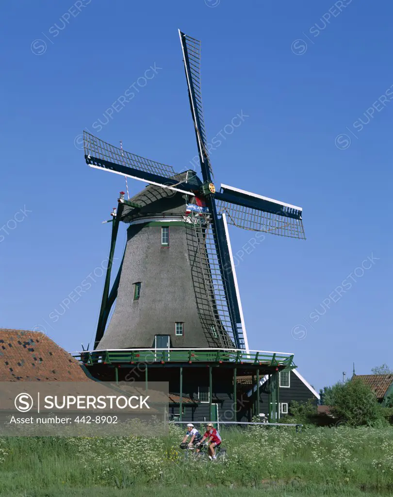Windmill and Cyclists, Zaanse Schans, Netherlands