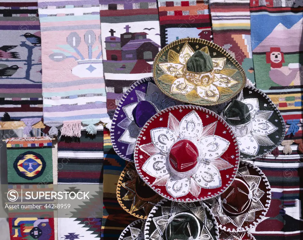 Close-up of sombreros and wall hangings at a souvenir store, Cancun, Mexico