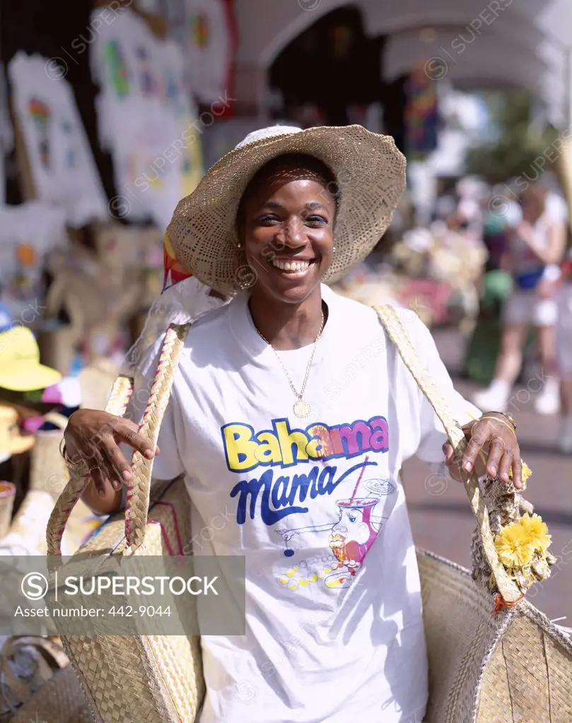 Portrait of a young woman carrying straw baskets, Straw Market, Nassau, Bahamas, Caribbean Islands