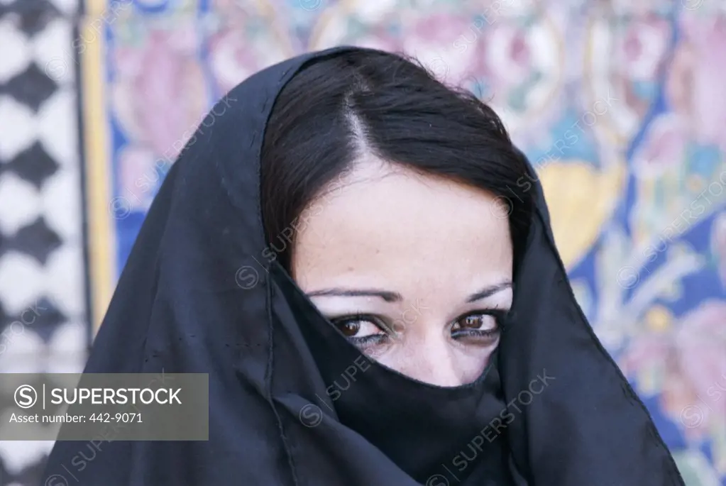 Portrait of a young Muslim woman wearing a headdress, Iraq