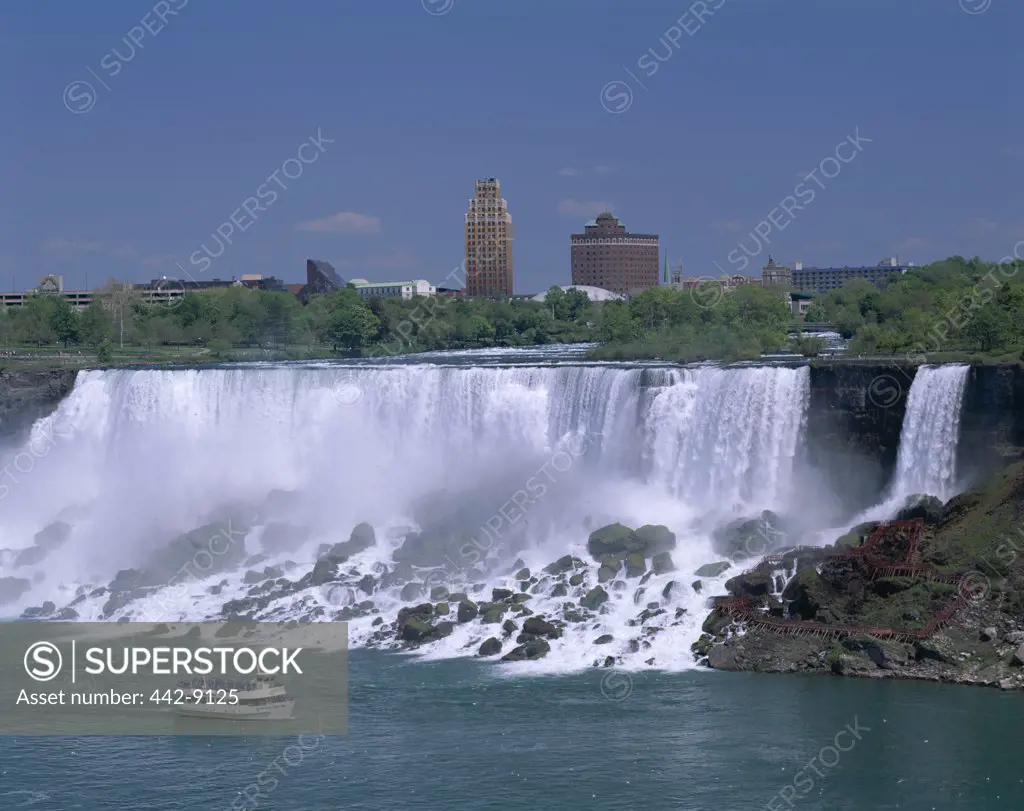 Tourboat in front of a waterfall, Maid of the Mist Boat Tour, Niagara Falls, Ontario, Canada