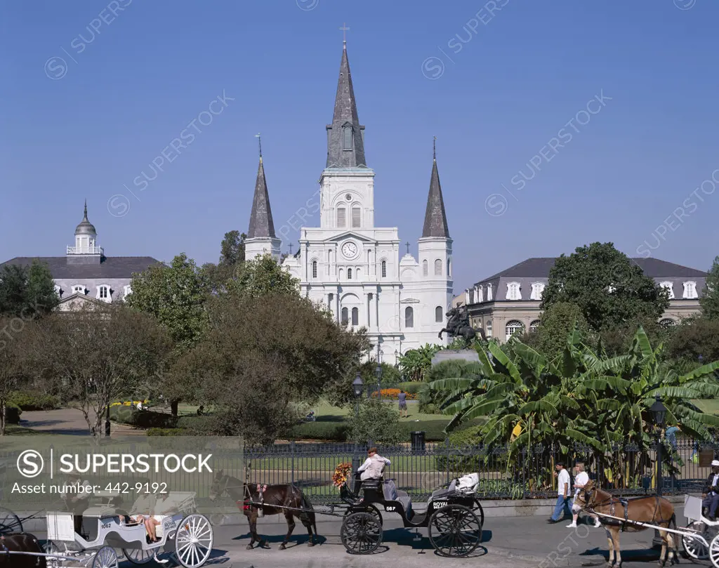 Horse carriages in front of a cathedral, St. Louis Cathedral, Jackson Square, New Orleans, Louisiana, USA