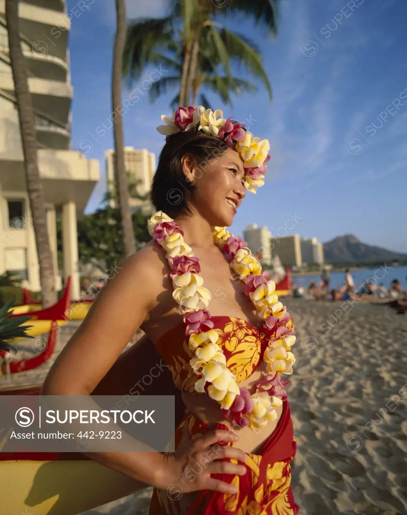 Side profile of a girl wearing leis, Waikiki Beach and Diamond Head, Honolulu, Oahu, Hawaii, USA