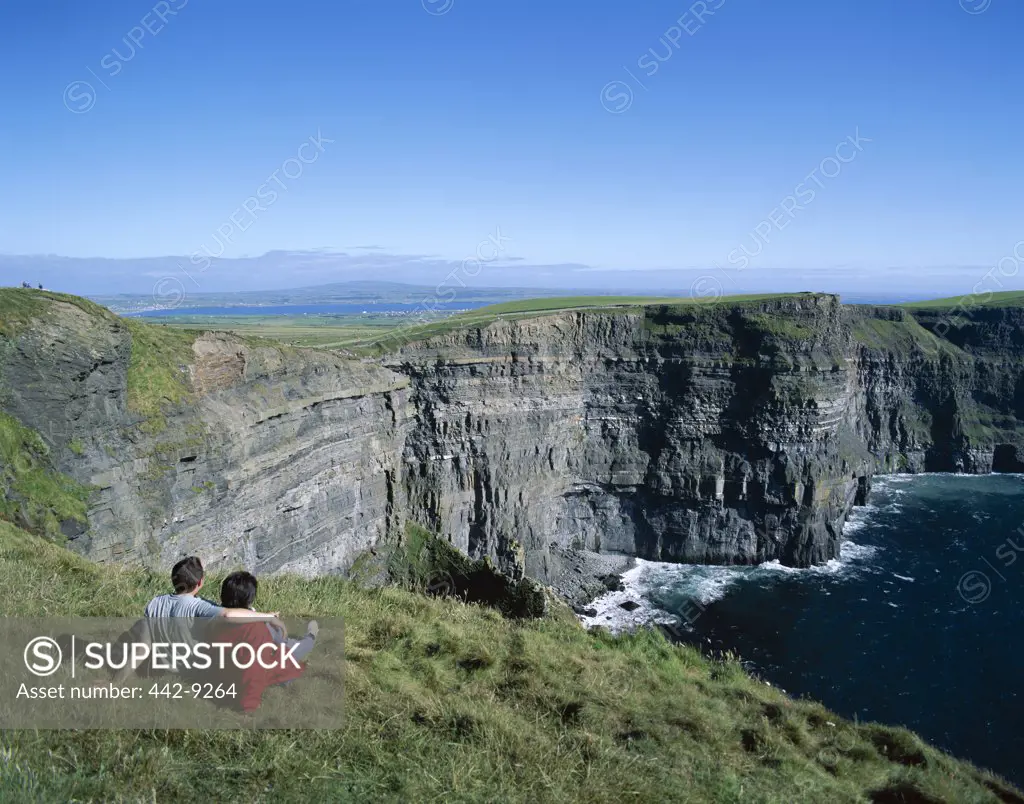 High angle view of tourists on a cliff, Cliffs of Moher, County Clare, Ireland