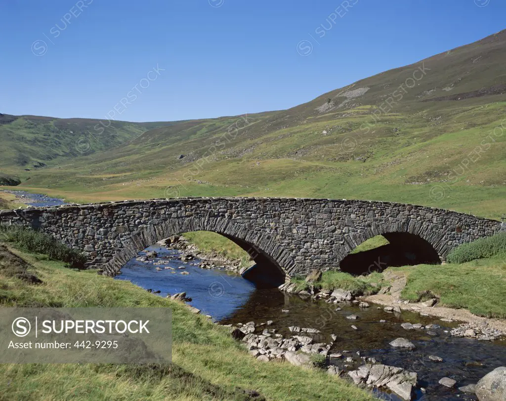Arch bridge across a stream, Stone Bridge and Rugged Hills, Glen Clunie, Braemar, Scotland