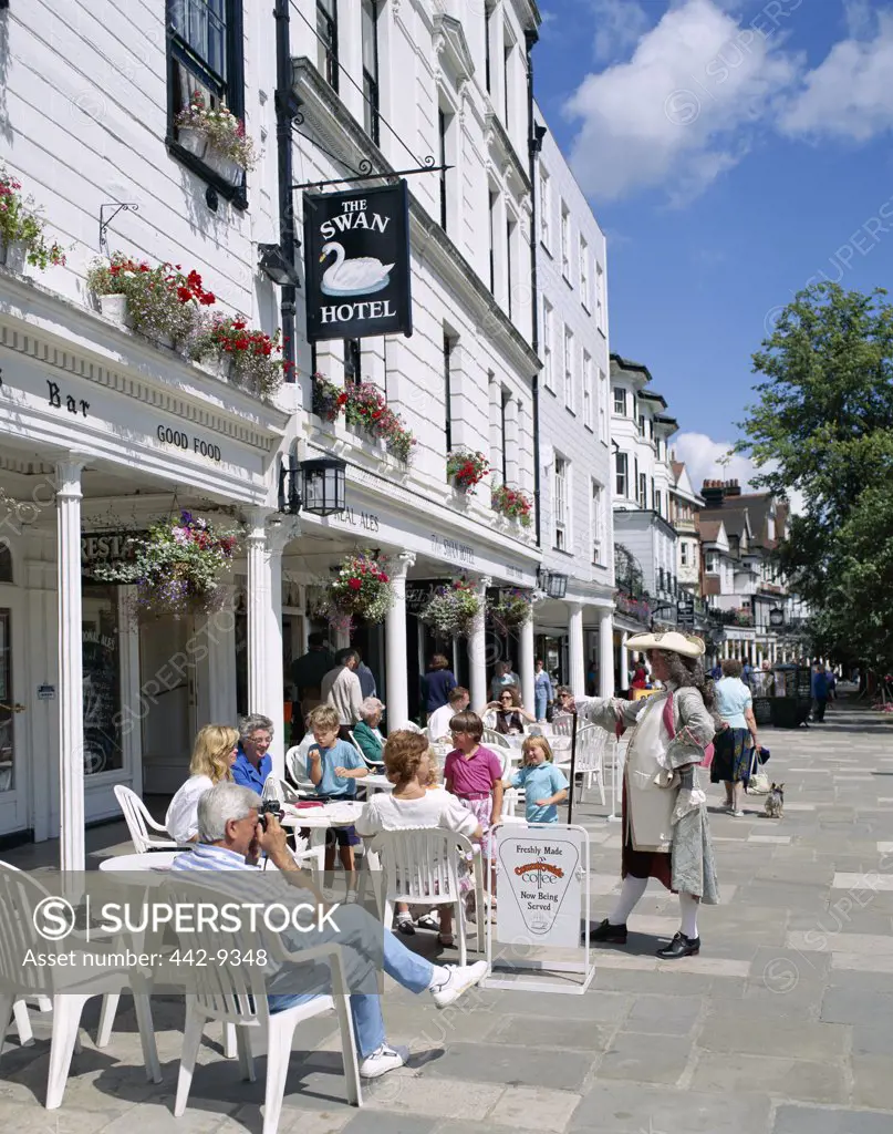 People sitting at an outdoor cafe, The Pantiles, Tunbridge Wells, Kent, England