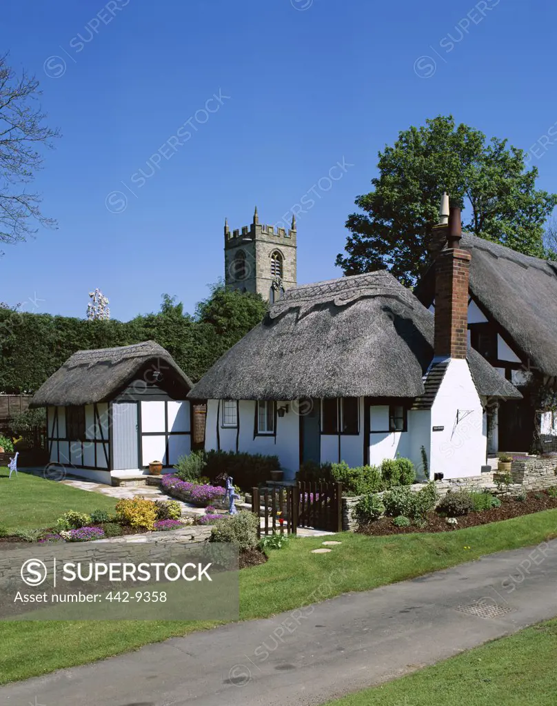 House and church at the side of a road, Welford-on-Avon, England