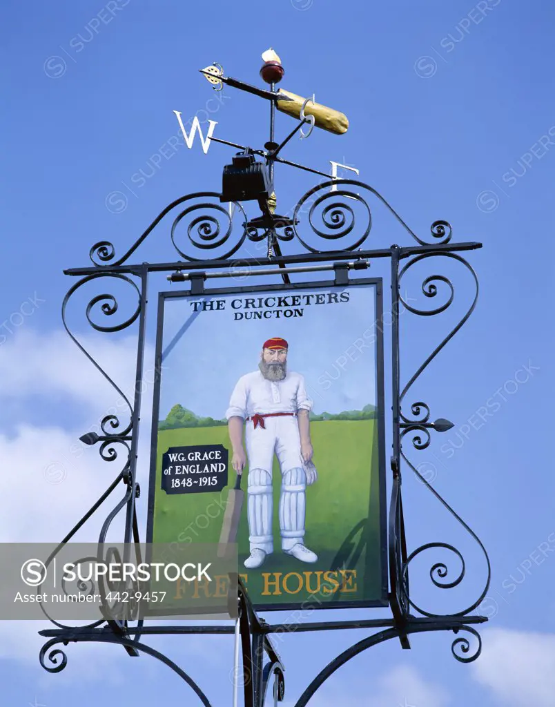 Low angle view of the Cricketers Pub signboard depicting W.G. Grace, Duncton, West Sussex, England