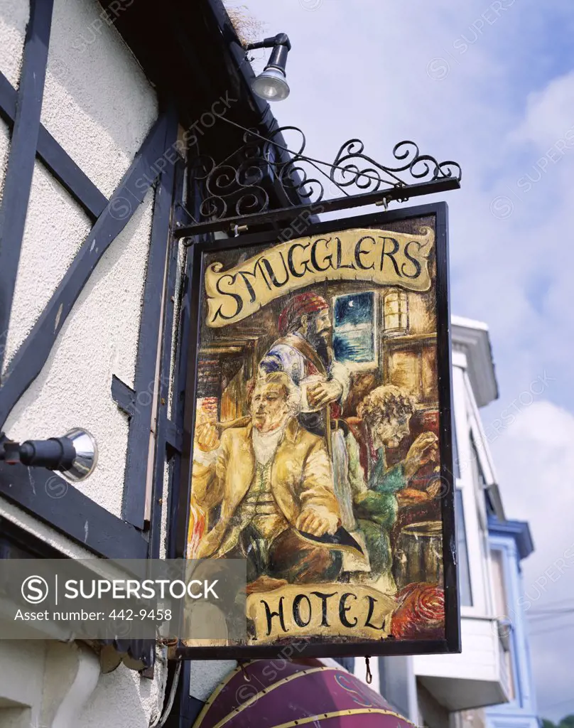 Low angle view of the Smugglers Hotel sign board, Newlyn, Cornwall, England