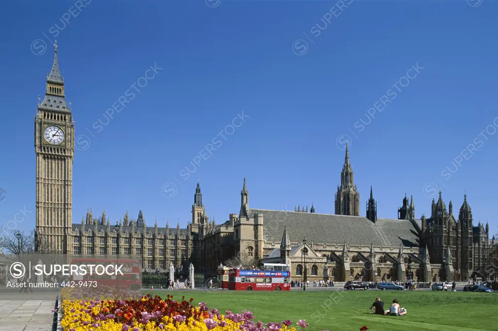Double-decker busses in front of Big Ben and the Houses of Parliament, Westminster, London, England