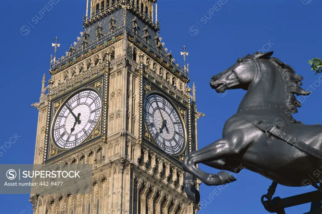 Low angle view of Big Ben and the Boadicea Statue, London, England