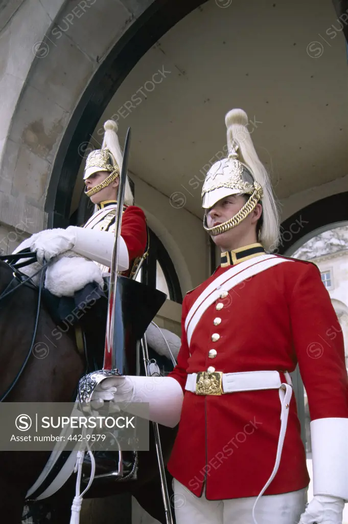 Low angle view of two horse guards, London, England