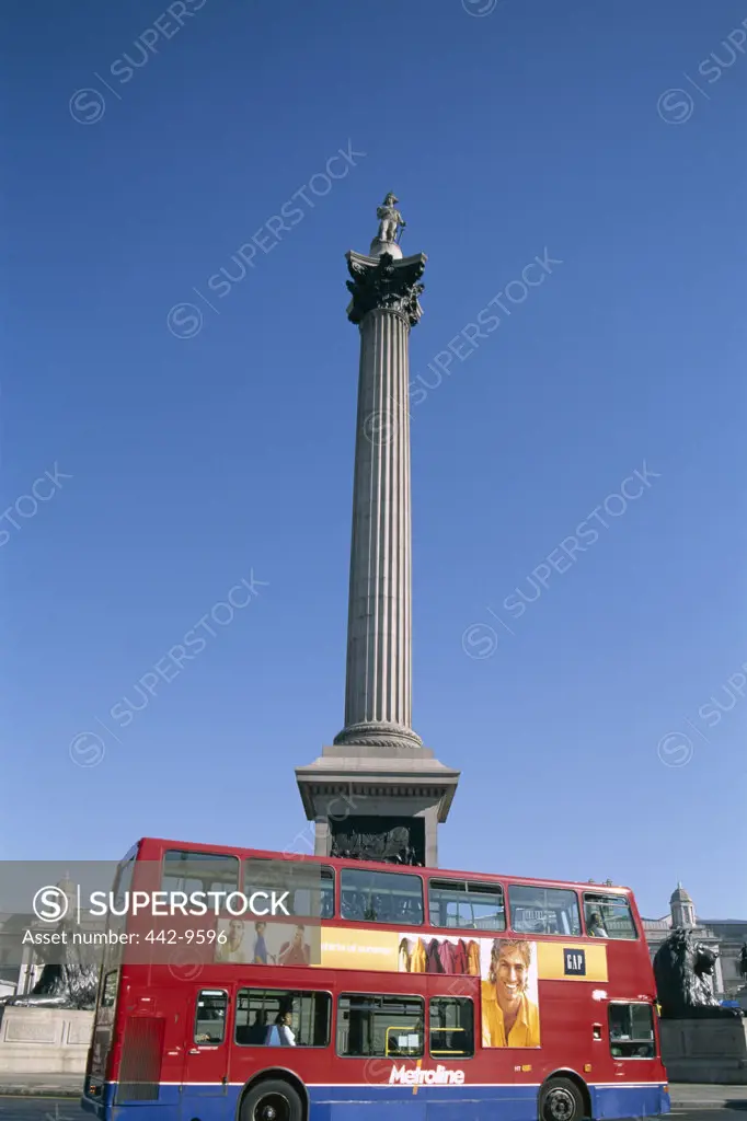 Low angle view of Nelson's Column and a double-decker bus, Trafalgar Square, London, England