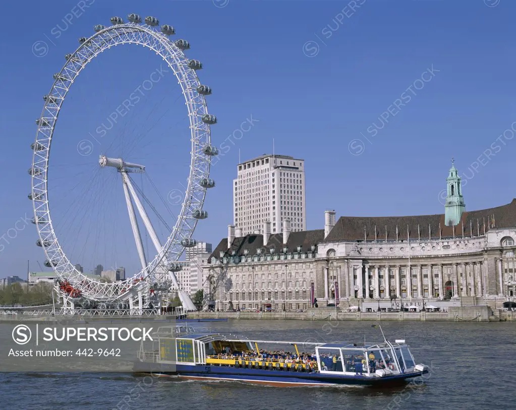 Tour boat in Thames River, London Eye, London, England