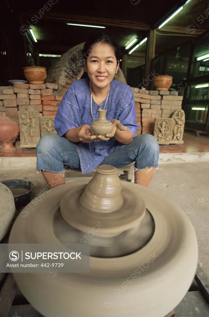 Portrait of a woman making pottery, Rose Garden, Bangkok, Thailand