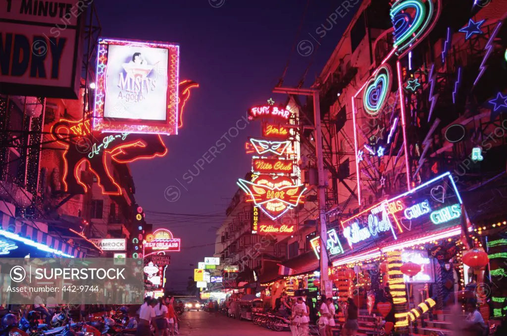 Signs on buildings lit up at night, Pattaya Beach, Pattaya, Thailand