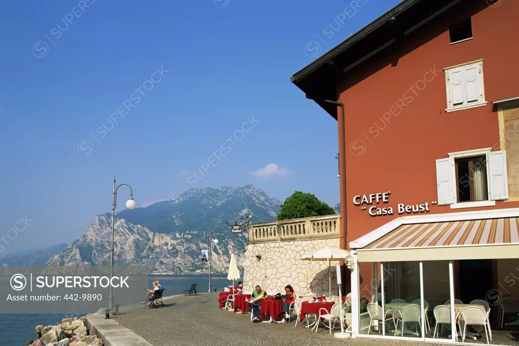 Sidewalk cafe on the waterfront, Lake Garda, Torbole, Lombardy, Italy