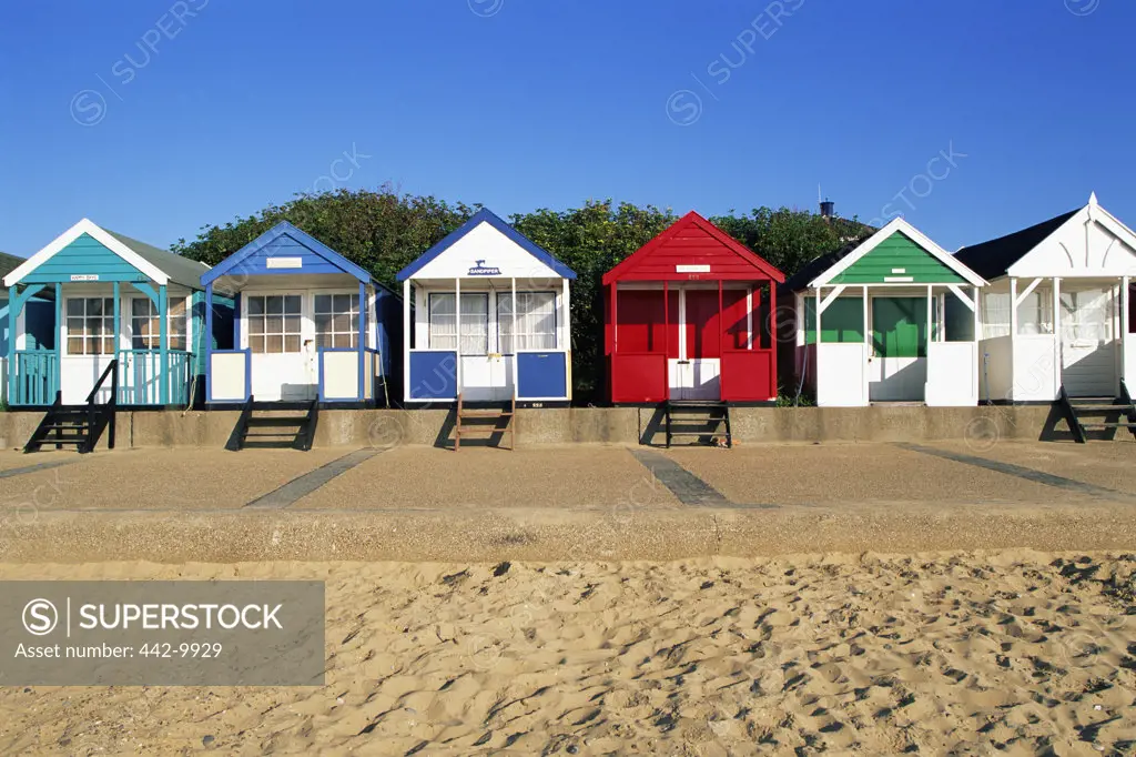 Beach huts in a row on the beach, Southwold, England