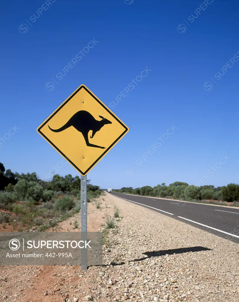 Kangaroo crossing sign on the road side, Australia