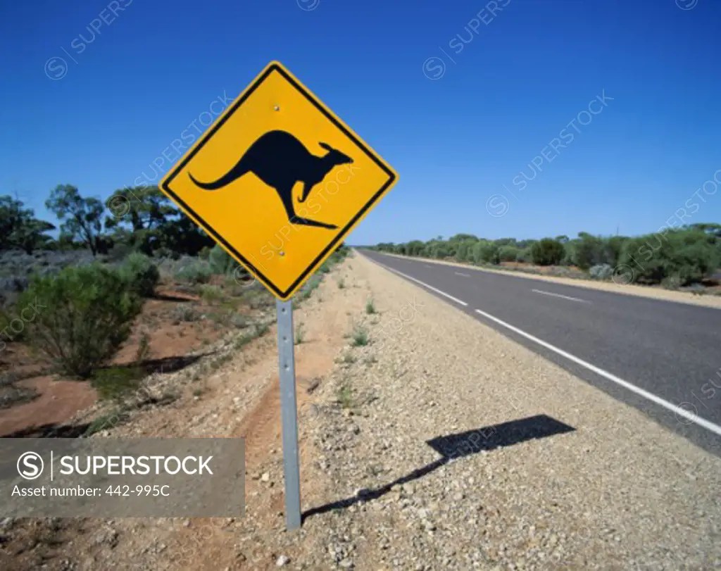 Kangaroo crossing sign on a roadside, Australia