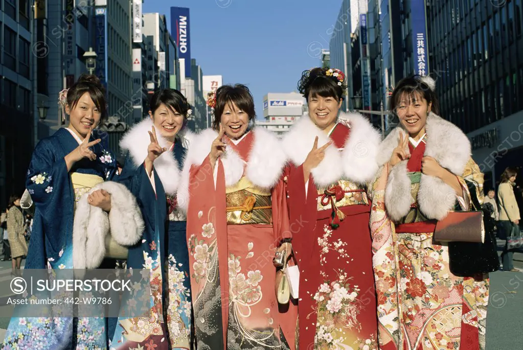 Portrait of five women smiling in traditional clothing, Tokyo, Japan
