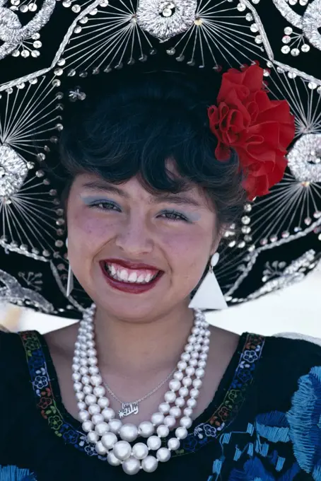 Portrait of a young woman wearing a sombrero, Mexico City, Mexico