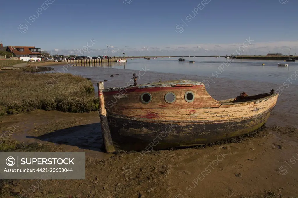 Abandoned boat on the mud flats of the River Ore near Orford, Suffolk.