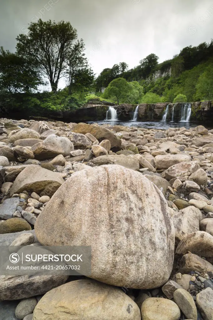 View of rocks, river and waterfall beneath limestone cliffs, Wain Wath Force, River Swale, near Keld, Swaledale, Yorkshire Dales N.P., North Yorkshire, England, June