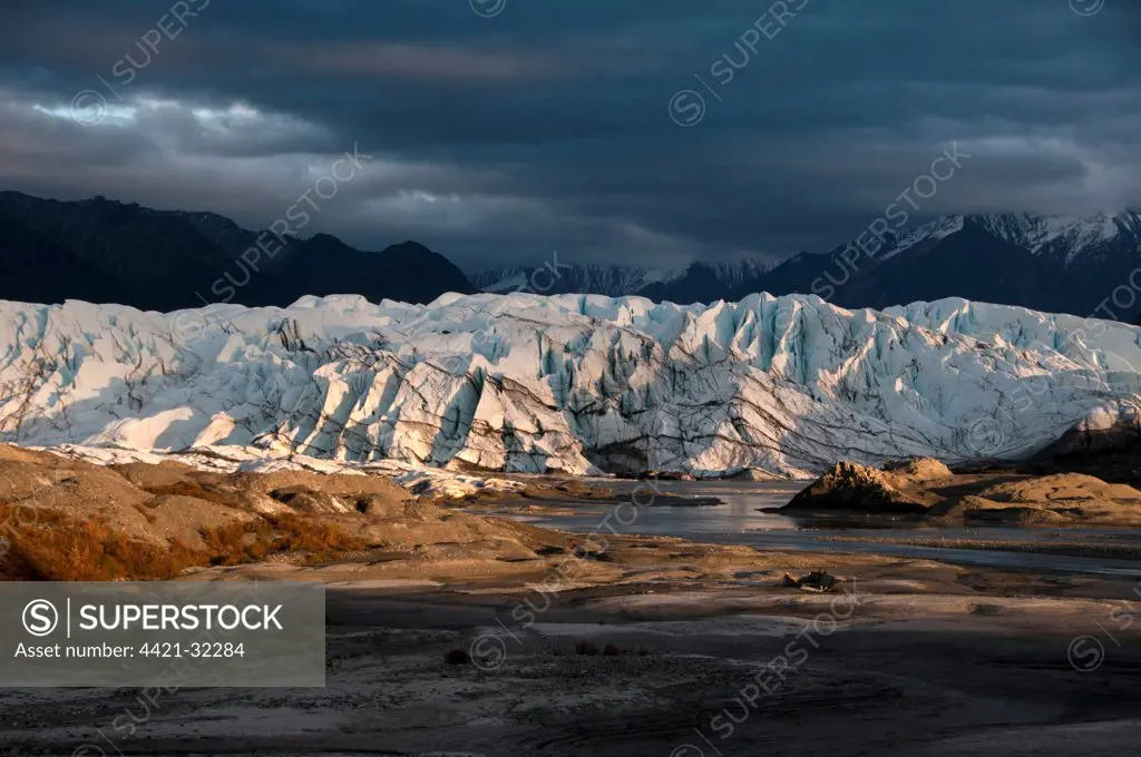 View of valley glacier terminus at sunset, Matanuska Glacier, Chugach Mountains, Alaska, U.S.A., september