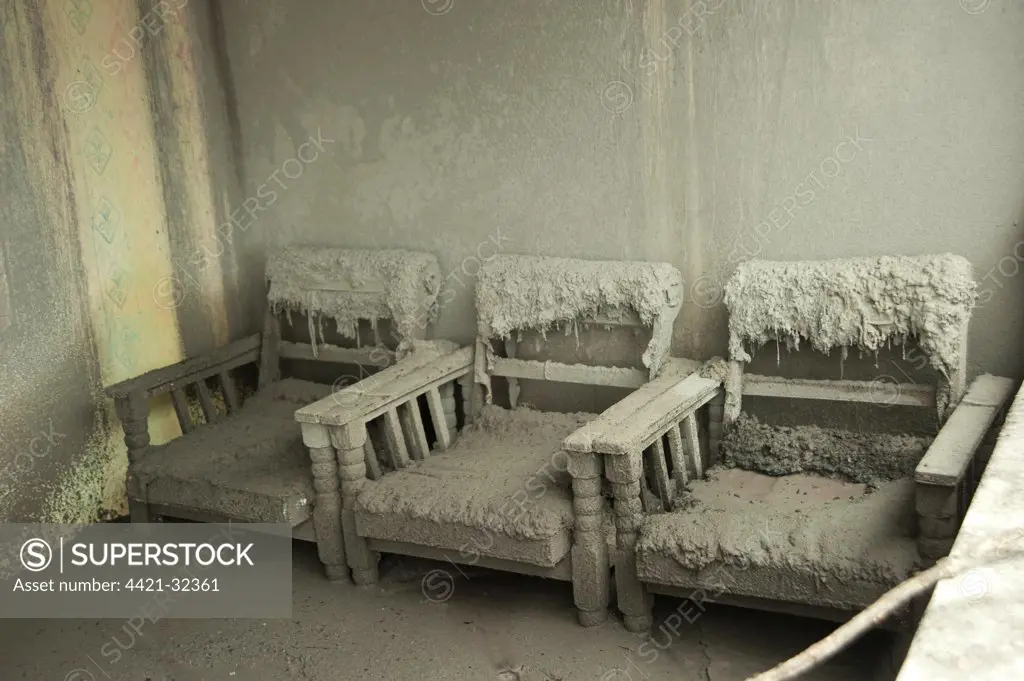 Ash covered chairs in house damaged from recent volcanic eruption, Kepuharjo, Mount Merapi, Central Java, Indonesia, november 2010