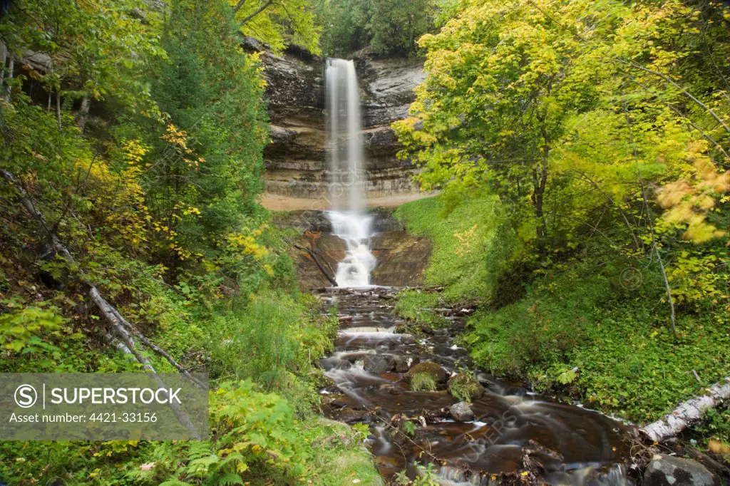 Waterfall flowing over sandstone cliff, Munising Falls, Munising Creek, Upper Peninsula, Michigan, U.S.A., october