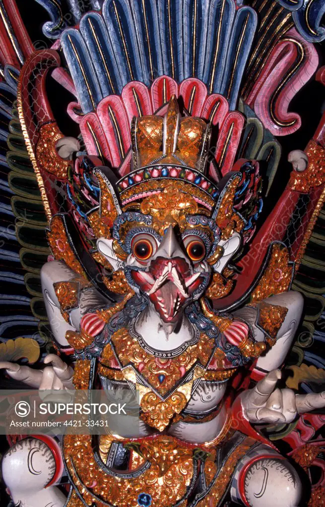 Indonesia A painted wood carving of a mythological creature, Bali
