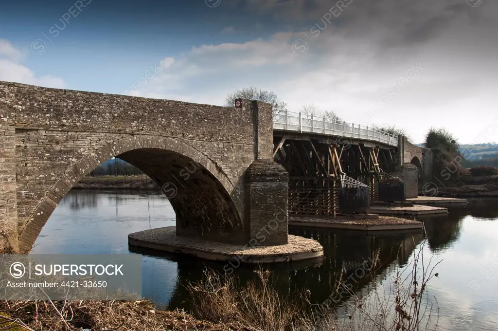 Toll bridge over river, River Wye, Whitney-on-Wye, Herefordshire, England, winter