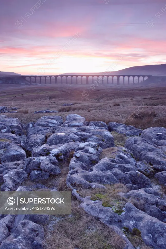 View of limestone rocks and Ribblehead Viaduct at sunset, Ribblehead, Ribblesdale, Yorkshire Dales N.P., North Yorkshire, England, january