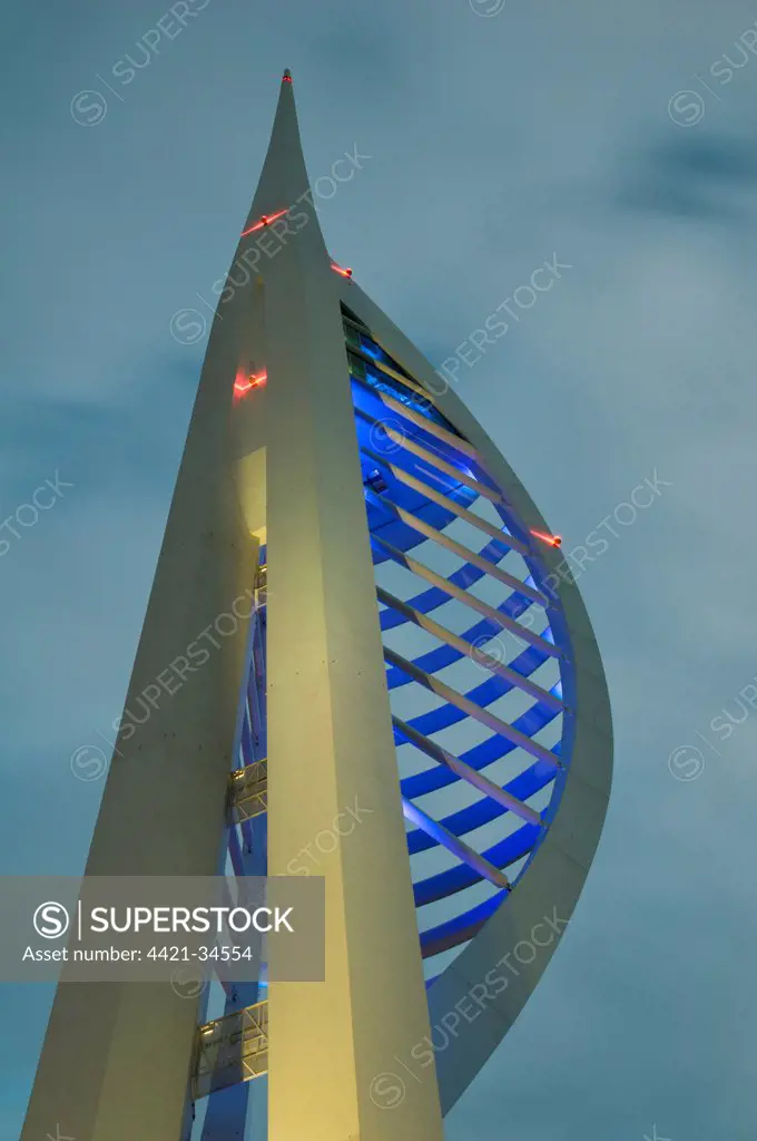 Spinnaker Tower illuminated under stormclouds at dusk, Portsmouth Harbour, Portsmouth, Hampshire, England, august