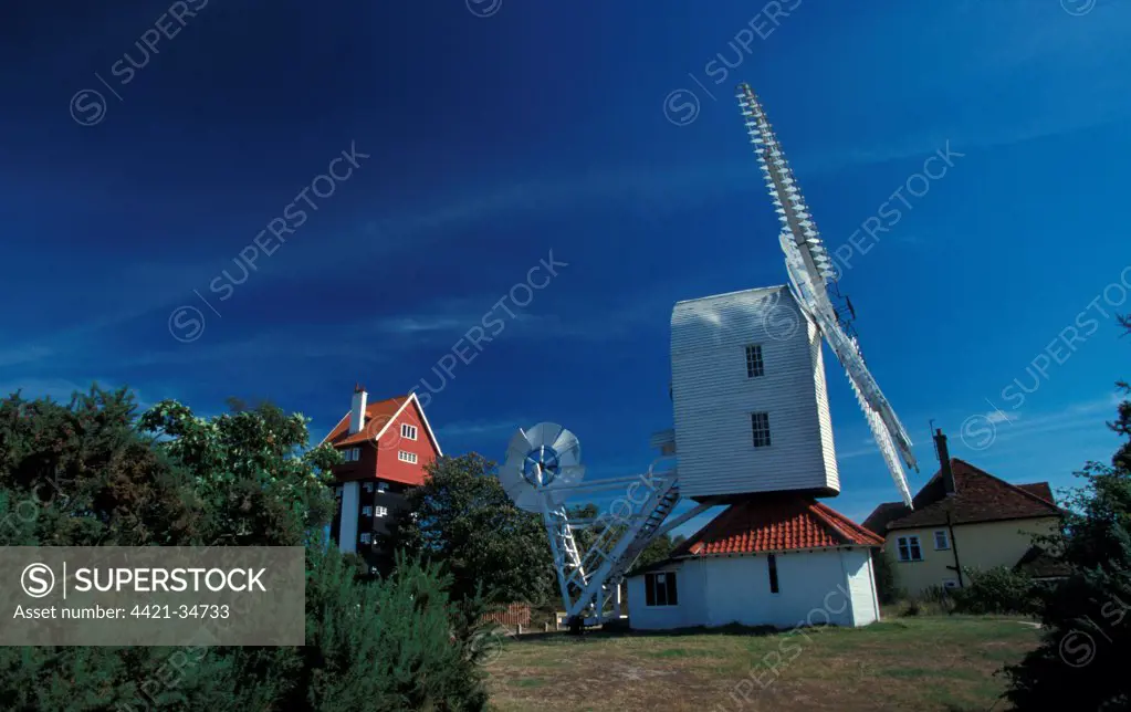 The 'House in the Clouds', converted water tower, and Thorpeness Windmill, disused windpump, Thorpeness, Suffolk, England