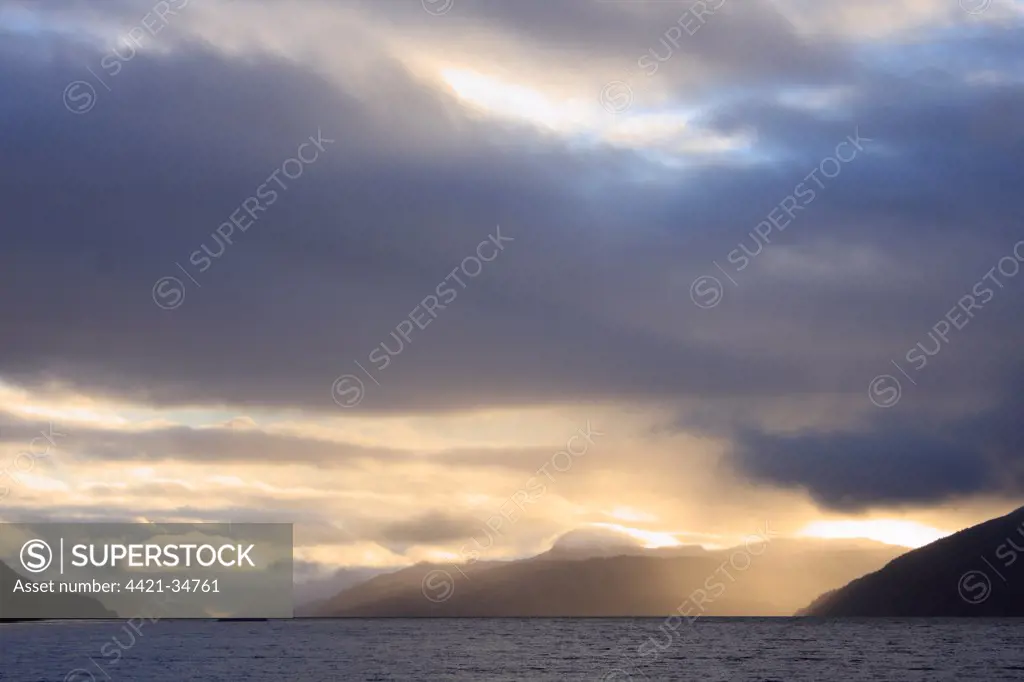 Clouds over loch at dusk, Loch Ness, Highlands, Scotland, february