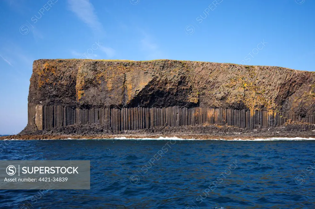 View of coastline with cliffs and columnar basalt rocks, Staffa, Inner Hebrides, Scotland, july