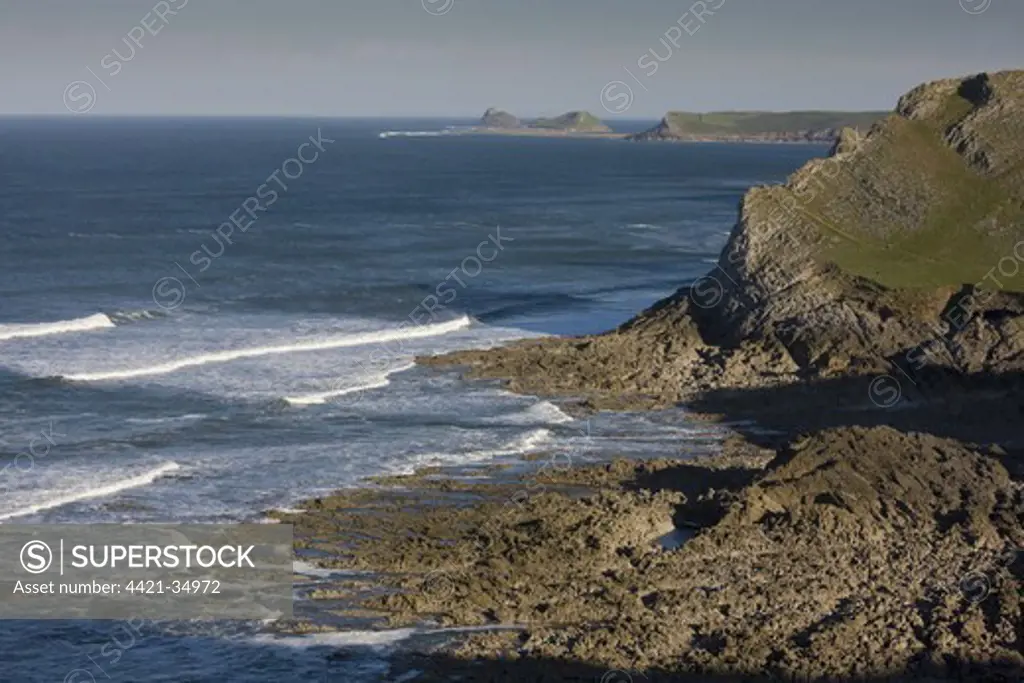 View west along limestone cliffs, towards Worms Head, Gower Peninsula, Wales