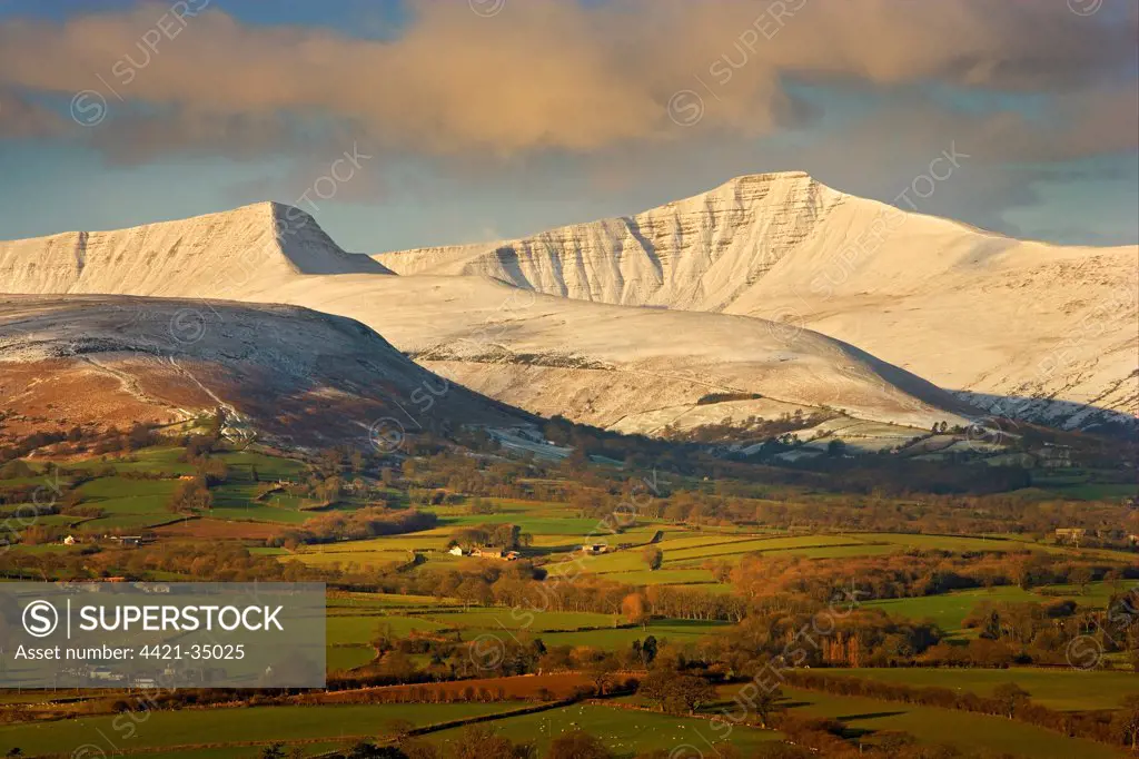 View of farmland and snow covered hills, looking from Llangorse (Talyllyn) area, Penyfan, Brecon Beacons N.P., Powys, Wales, march