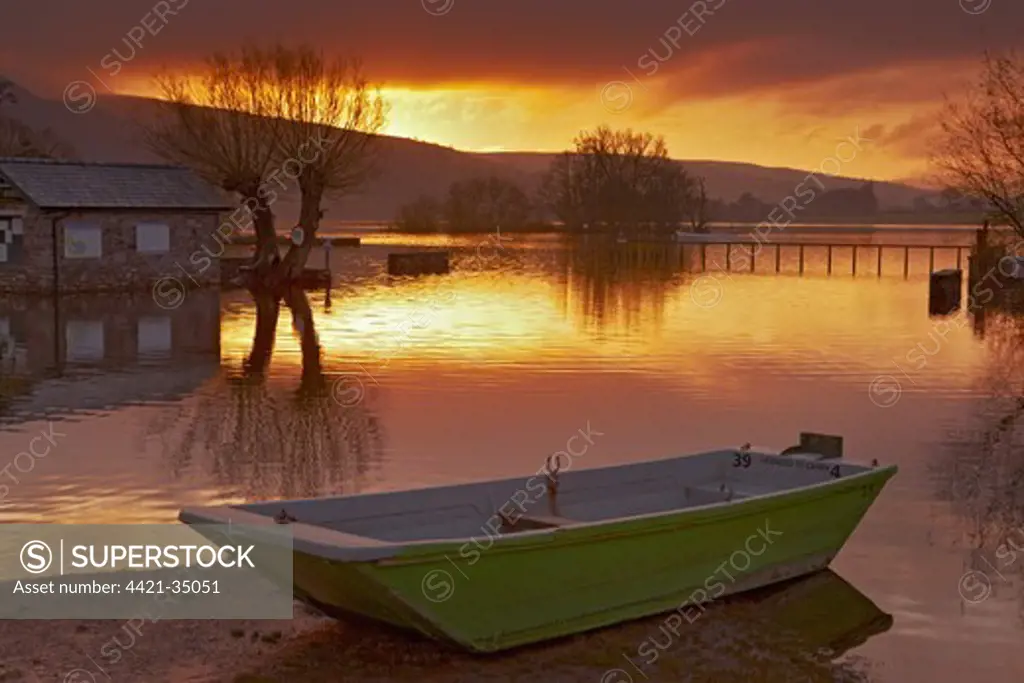 Boat beside lake at flood level during sunrise, Llangorse Lake, Brecon Beacons N.P., Powys, Wales, december