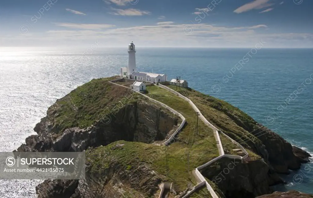 View of lighthouse and coastline, South Stack Lighthouse, RSPB South Stack Cliffs, Anglesey, Wales, august
