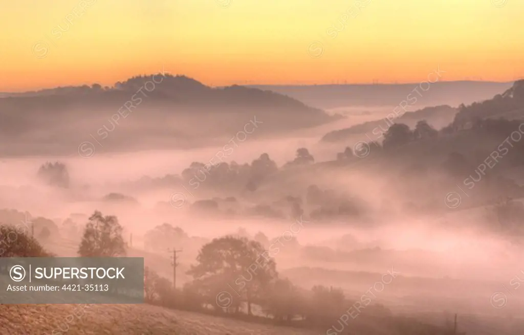 View of mist and frost in valley at sunrise, Upper Severn (Hafren) Valley, near Llanidloes, Powys, Wales, october