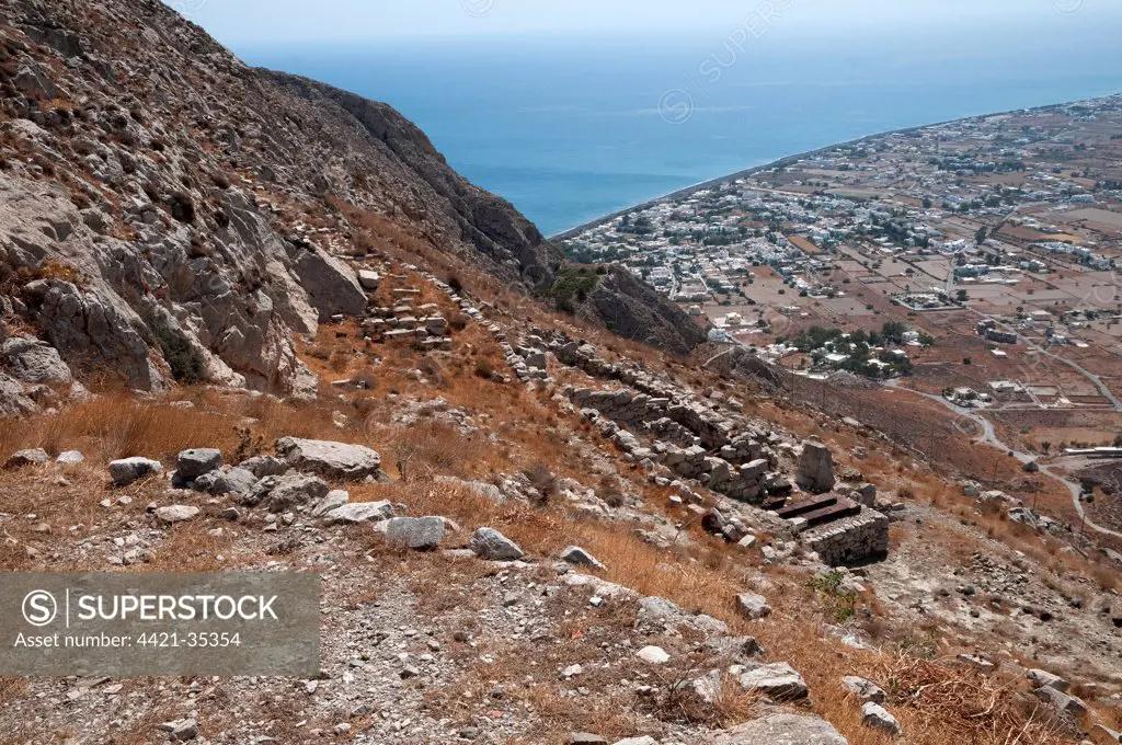 Ancient city ruins, Sanctuary of Aphrodite, with Perissa in background, Ancient Thera, Mesavouno, Santorini, Cyclades, Aegean Sea, Greece, September