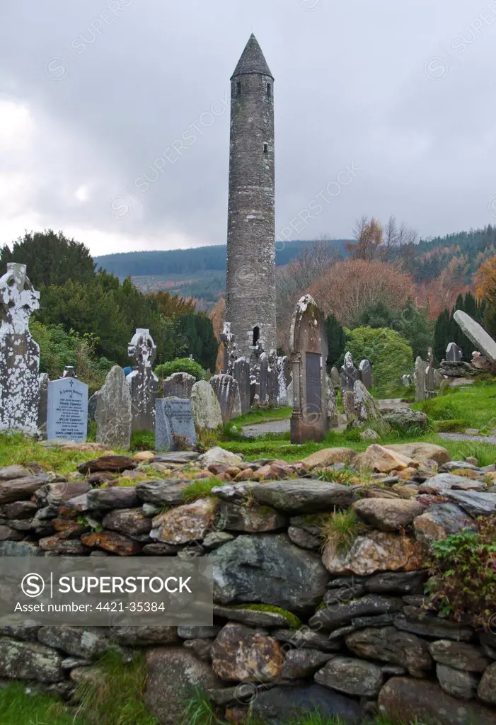 Early Medieval monastic building and graveyard, Round Tower, Glendalough Monastic Site, Wicklow Way Walking Route, Glendalough Valley, Wicklow Mountains N.P., County Wicklow, Ireland, november