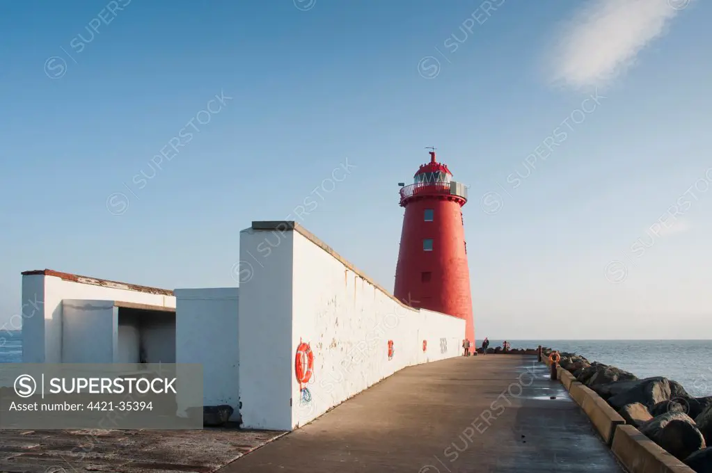 Lighthouse on sea wall protecting harbour entrance, Poolbeg Lighthouse, Great South Wall, Dublin Port, Dublin Bay, Ireland, november